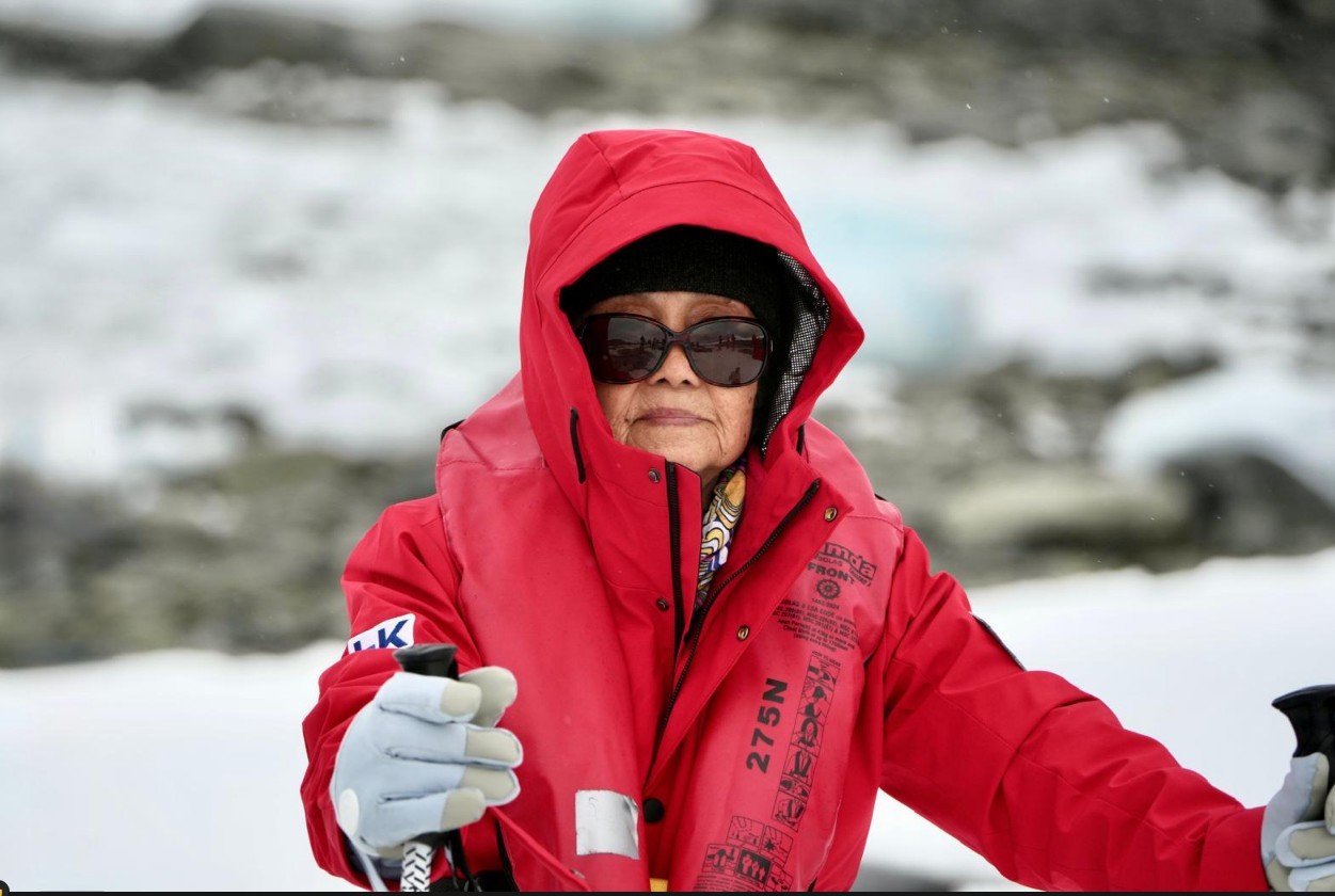 Elderly lady enjoying Antarctica with family after vertebroplasty